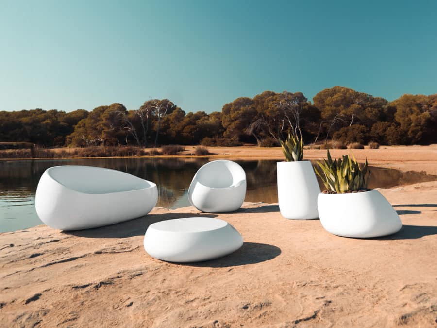 Vondom - STONE collection showing sofa, lounge chair, coffee table, and various planters